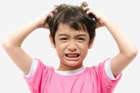 Boy scratchng head